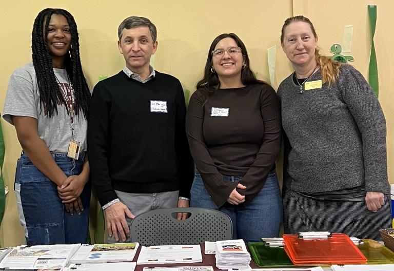 SSW students and faculty provide information about low-cost dental care at the Give Kids a Smile Event: Left to right: Kania Johnson, MSW Student; Joe Merighi, Associate Professor; Tiffany Ramirez, MSW Student; Kelley Leaf, Practicum Coordinator.
