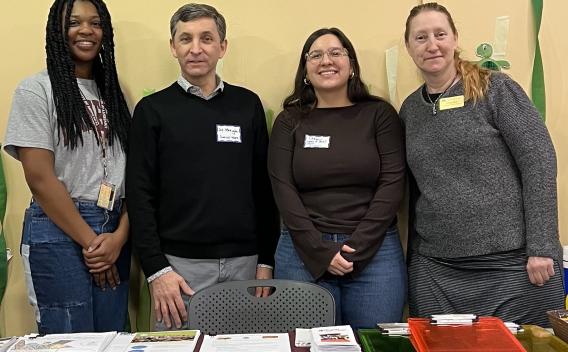 SSW students and faculty provide information about low-cost dental care at the Give Kids a Smile Event:  Left to right: Kania Johnson, MSW Student; Joe Merighi, Associate Professor; Tiffany Ramirez, MSW Student; Kelley Leaf, Practicum Coordinator.