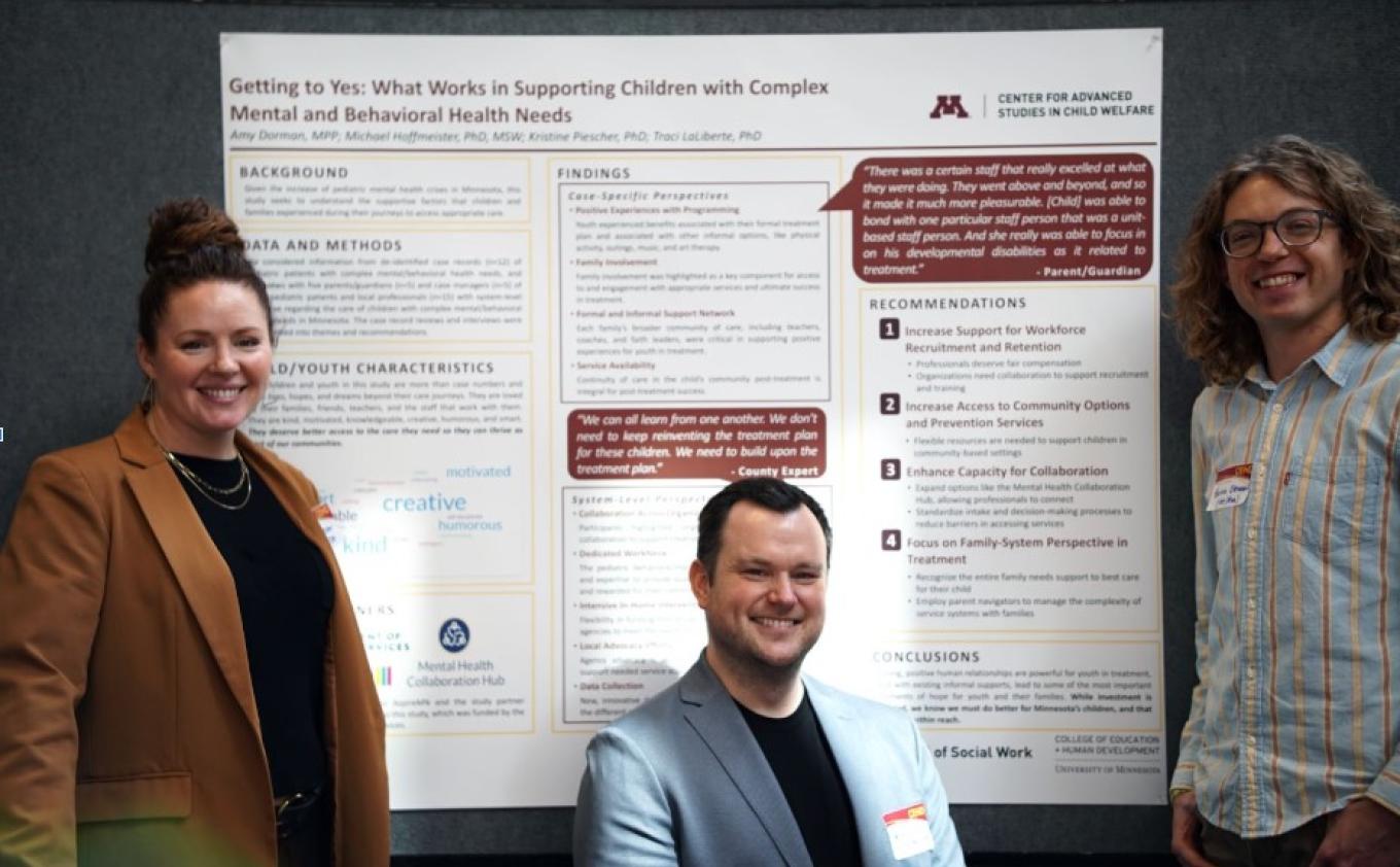 Three Minn-Link researchers stand in front of a poster outlining their research findings. From left to right: Kristine Piescher, PhD, Michael Hoffmeister, PhD, Quinn Oteman, MSW, present CASCW’s latest Getting to Yes research findings at the CEHD Research & Innovation Day on March 20, 2025.