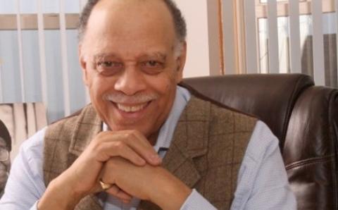 African American Read In Speaker Dr. Haki Madhubuti sitting in his office.